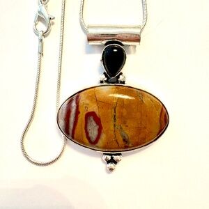 1 3/4 in,925 marked, Decent Wave Dolomite and black Onyx pendant on a chain.